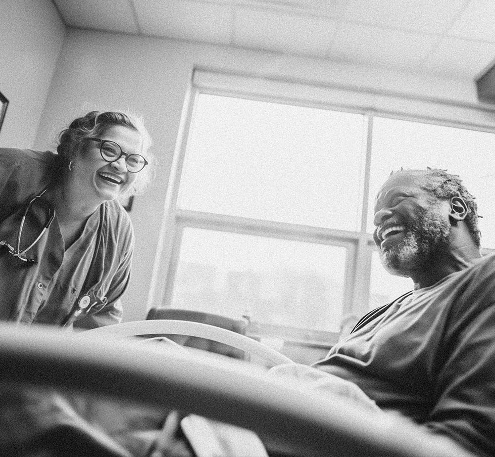 Patient-in-bed-with-HCP