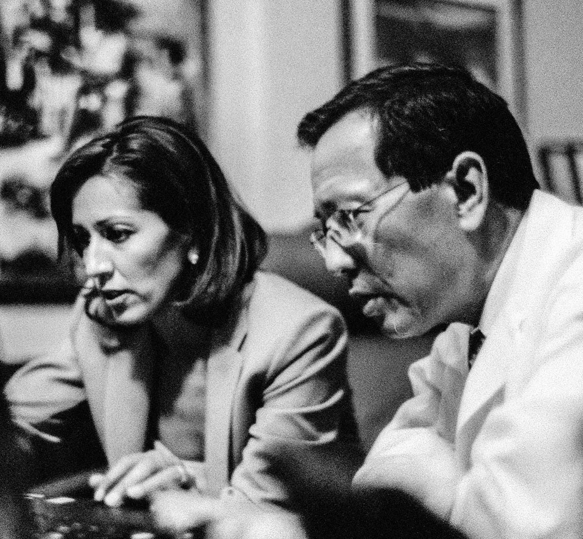 two-people-looking-at-a-computer